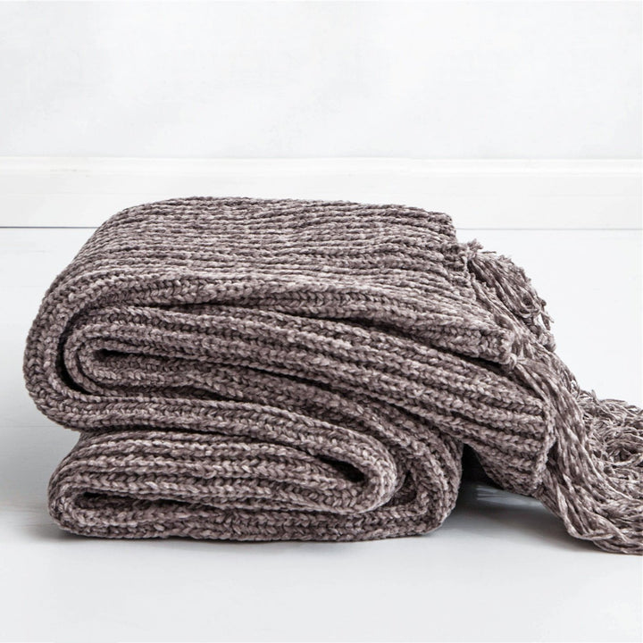 Gray Long Tassel Knitted Throw Blanket, offering a chic tassel design and ultra-soft comfort. Crafted from premium polyester, this cozy blanket adds texture and flair to any space. Perfect for dorm rooms, living rooms, or any cozy corner.