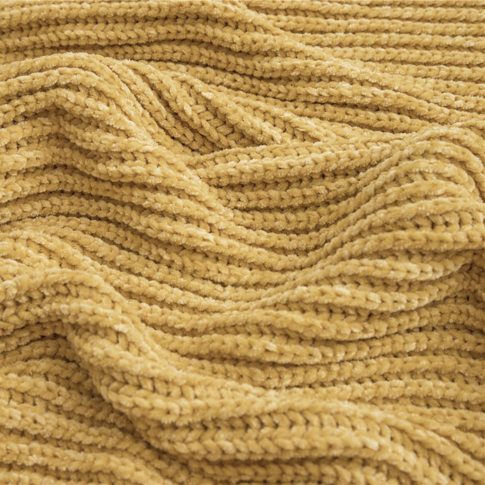 Close-up of the yellow material of the Long Tassel Knitted Throw Blanket, highlighting its soft, premium texture and cozy knit design. A perfect blend of style and comfort for any space.