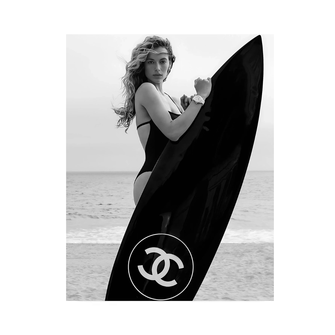 VibeCore Luxury Surf Canvas Prints Option B: Blonde girl holding black Chanel surf board on beach