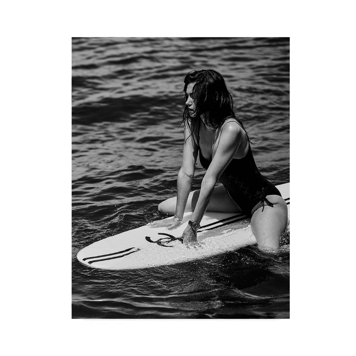VibeCore Luxury Surf Canvas Prints Option C: Brunette girl sitting on white Chanel surf board in water