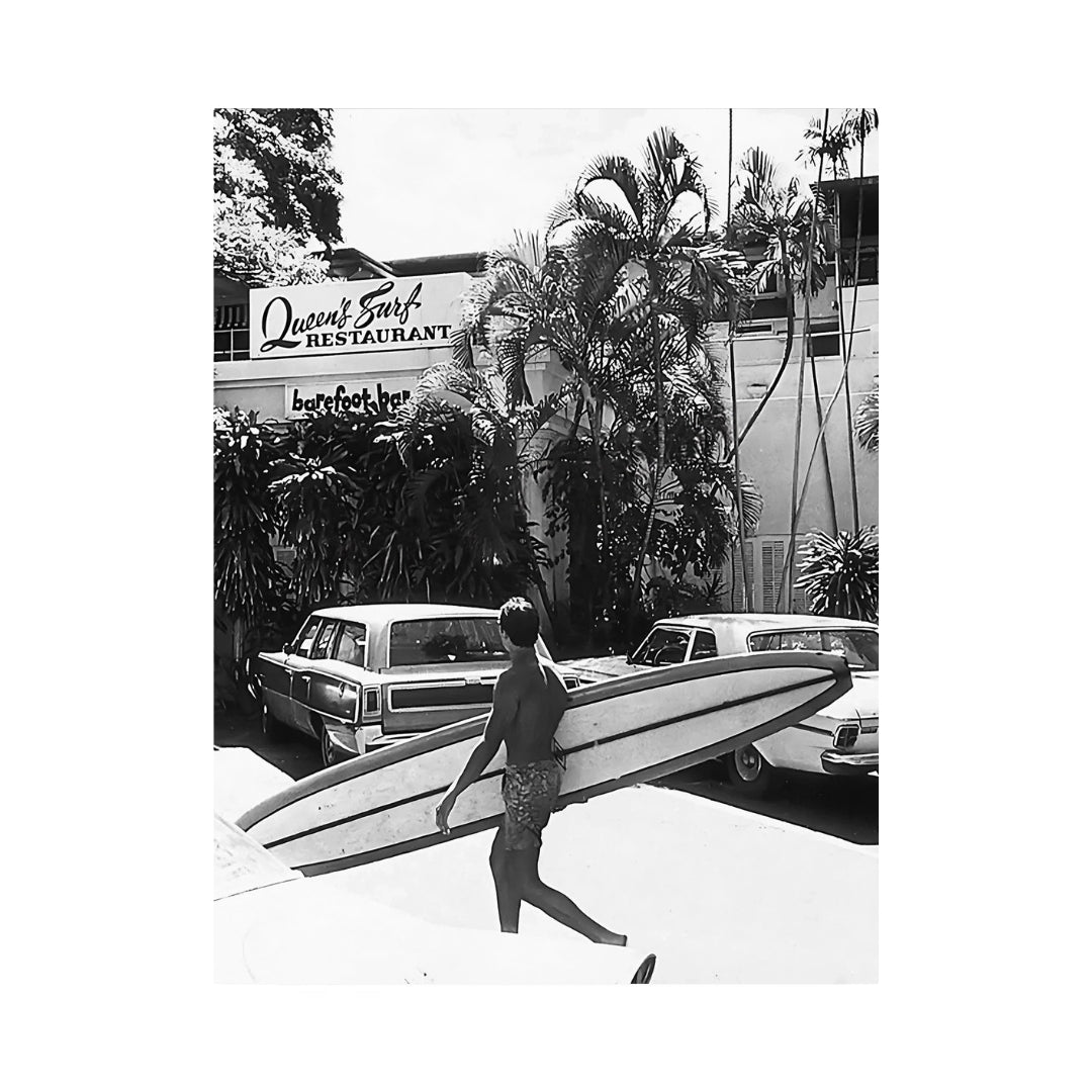 VibeCore Luxury Surf Canvas Prints Option I: Guy holding surfboard walking in front of a restaurant 