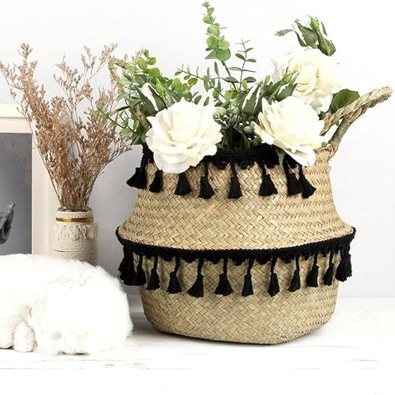 VibeCore MALA Handmade Macrame Basket in black with flowers inside, showcasing a handwoven design made from organic wicker and cotton, perfect for decorative storage.