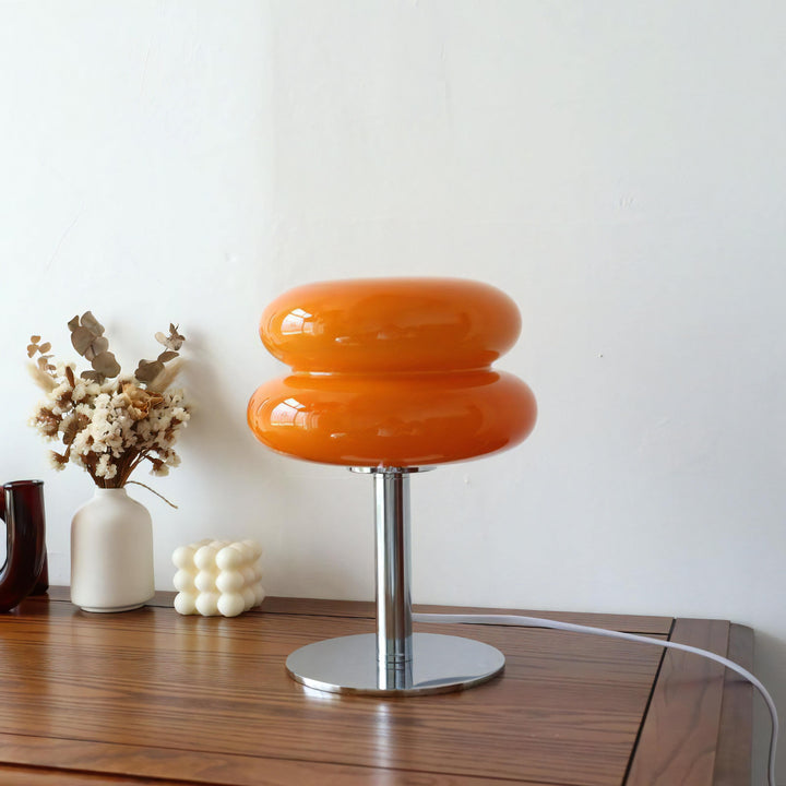 VibeCore Macarons Glass Table Lamp in orange, adding a vibrant and playful touch to any room with its Bauhaus-inspired design.