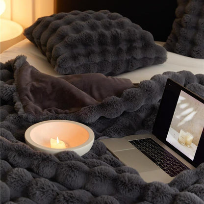 VibeCore Marshmallow Ultra Plush Blanket Black Close Up On Bed, demonstrating its soft and plush feel.