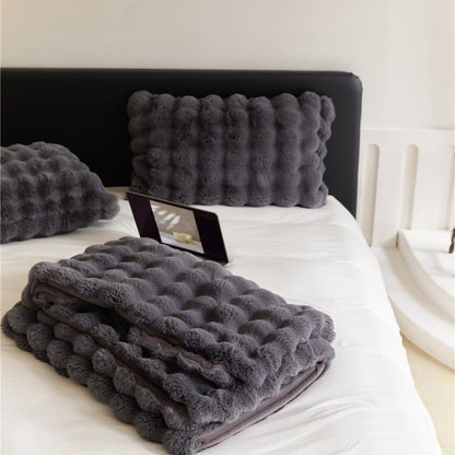 VibeCore Marshmallow Ultra Plush Blanket Black Folded On Bed, demonstrating its thickness.
