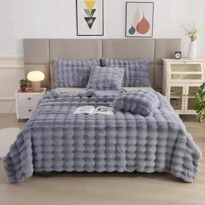 VibeCore Marshmallow Ultra Plush Blanket Gray On Bed, showcasing its aesthetic appeal in a bedroom setting.