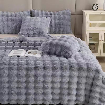 VibeCore Marshmallow Ultra Plush Blanket Gray Right Front View On Bed, demonstrating it's aesthetic and high-quality features.