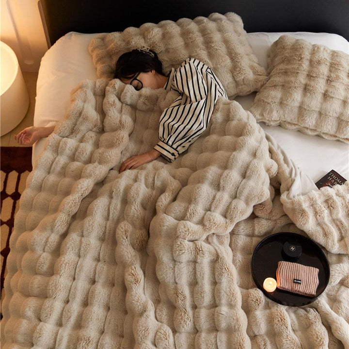 VibeCore Marshmallow Ultra Plush Blanket Khaki Woman Napping In It In Bed, showcasing its ultra cozy feature.