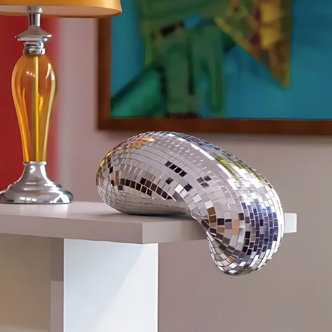 The VibeCore Melting Disco Ball, a handcrafted piece with a unique melting design, featuring a reflective surface that creates mesmerizing light reflections, adding dynamic style to any room.