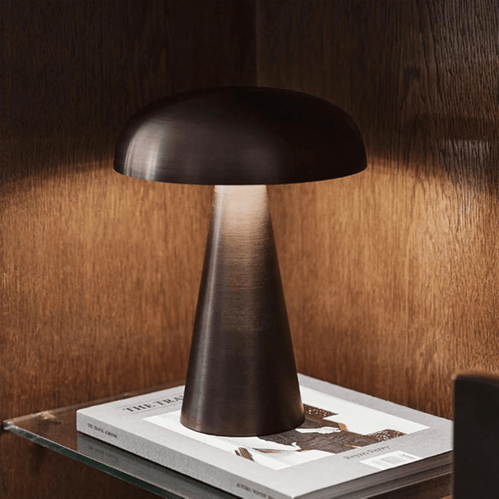 VibeCore Metal Mushroom Touch Lamp in bronze, positioned on a side table, highlighting its sleek, minimalist design and touch-sensitive control for easy brightness adjustment.