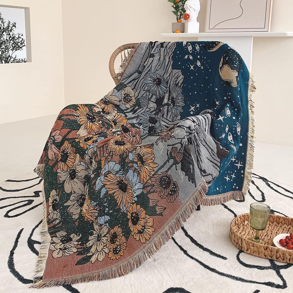 VibeCore Midnight Mountain Woven Blanket on chair, featuring a mountain-inspired design and soft 100% combed cotton fabric.
