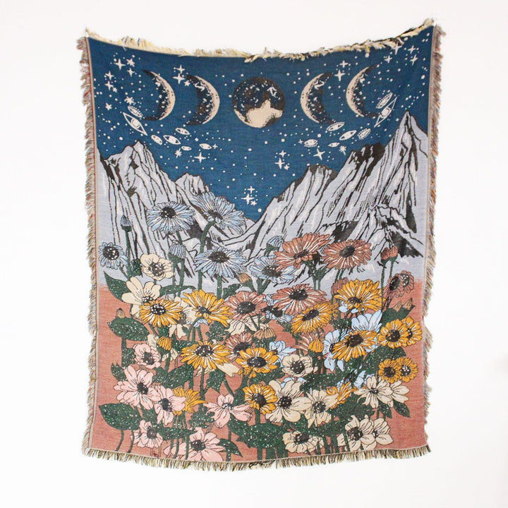 VibeCore Midnight Mountain Woven Blanket product view, featuring a mountain-inspired design and soft 100% combed cotton texture.