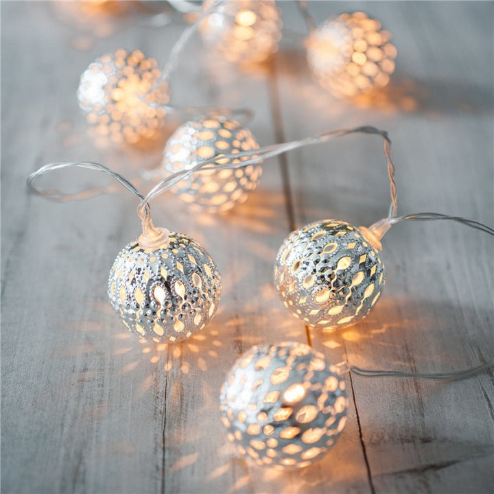 VibeCore Moroccan Orbs String Lights in silver bring a cozy, radiant glow to any space. These battery-powered LED lights are perfect for adding a touch of elegance to your bedroom, dorm, or apartment.