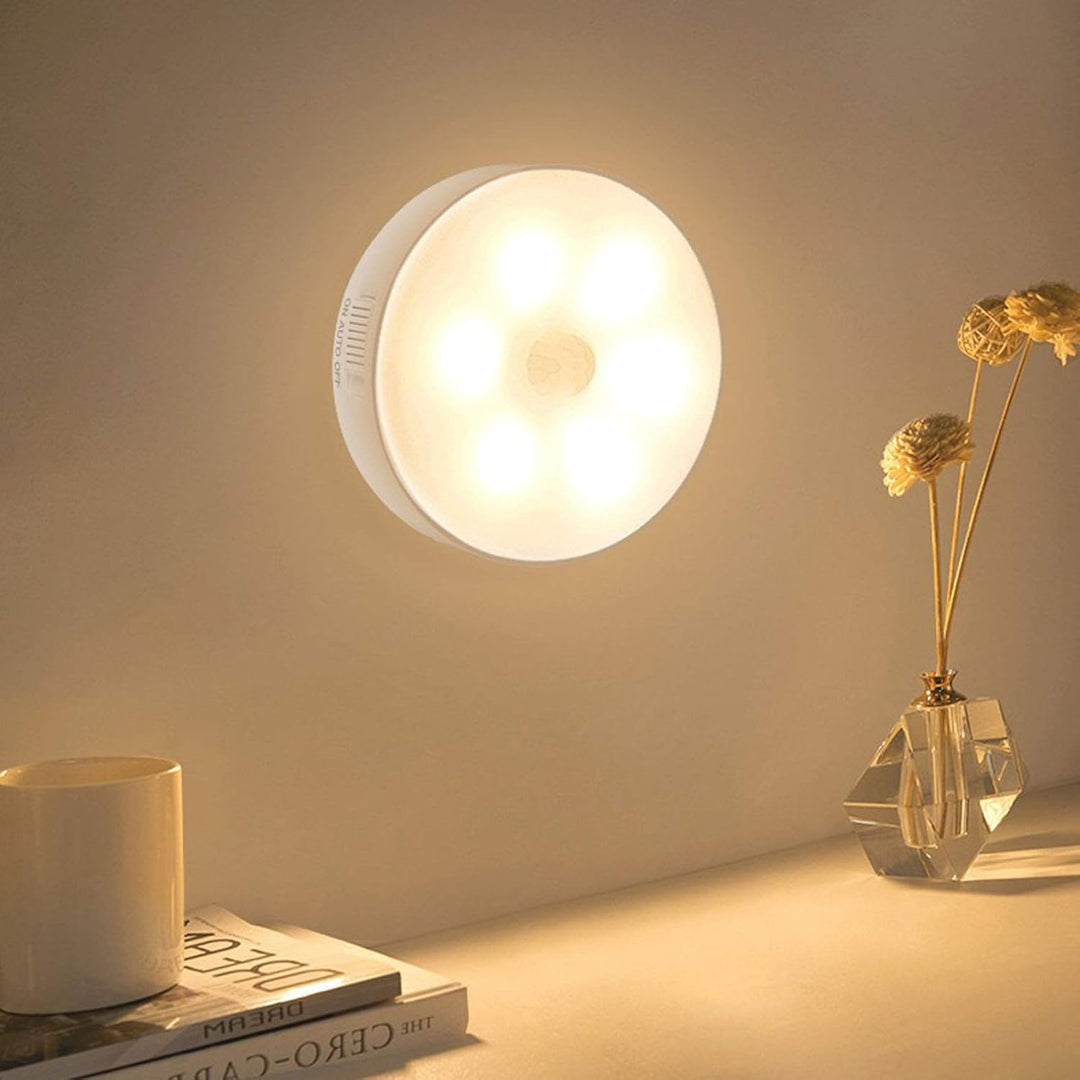 VibeCore Motion Sensor Puck Light - Modern motion-activated LED light with PIR sensor, 9.8 ft range, USB rechargeable battery, and versatile installation options for closets, vanities, and home decor.
