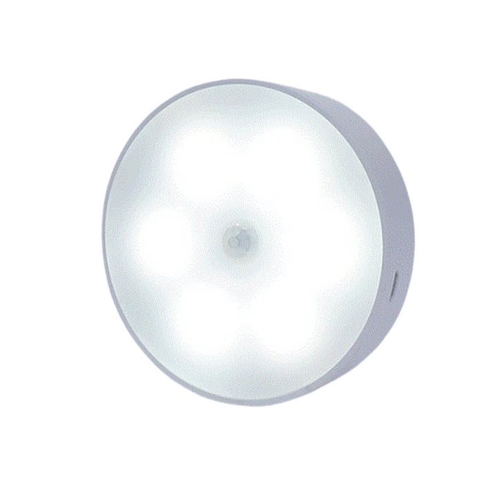VibeCore Motion Sensor Puck Light in White - Modern motion-activated LED light with PIR sensor, 9.8 ft range, USB rechargeable battery, and versatile installation for closets, cabinets, and home decor.