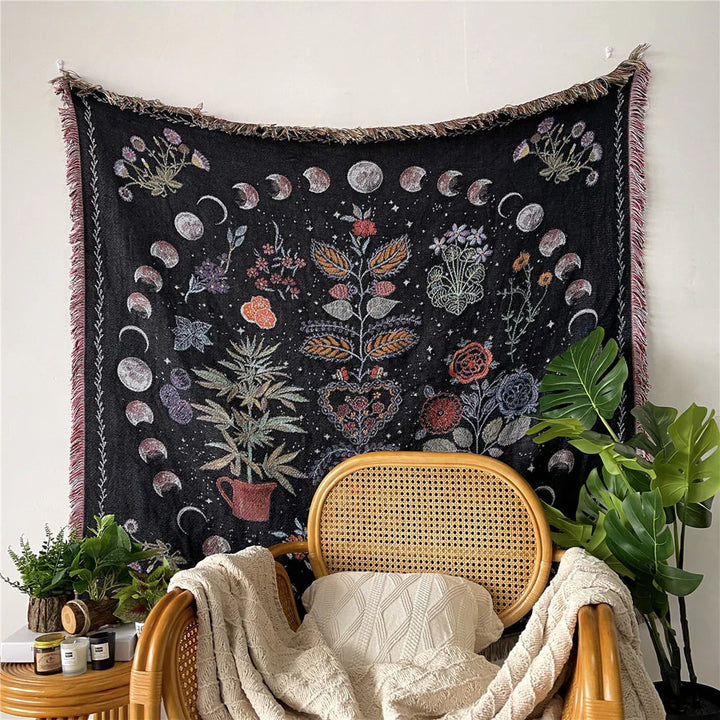 VibeCore Mystic Bloom Woven Blanket hanging on a wall, featuring a vibrant floral design in soft, 100% combed cotton, adding an enchanting, nature-inspired vibe to the room.