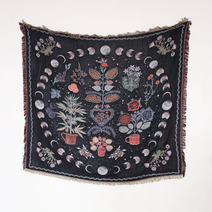 VibeCore Mystic Bloom Woven Blanket displayed flat, highlighting its intricate floral pattern and soft, breathable 100% combed cotton material, designed for versatile use as a throw, wall hanging, or tablecloth.