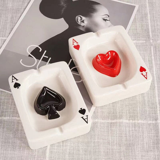 VibeCore Playing Card Ashtray featuring spades and hearts designs, showcasing a quirky card game-inspired look. The durable ceramic ashtrays are sleek, glossy, and perfect for adding a unique touch to any room.