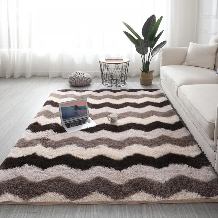 VibeCore Plush Patterned Area Rug in brown zigzag pattern, featuring a soft polyester fiber texture and non-slip backing. Adds a cozy, stylish touch to any room. Easy to clean and available in 5 stylish options.