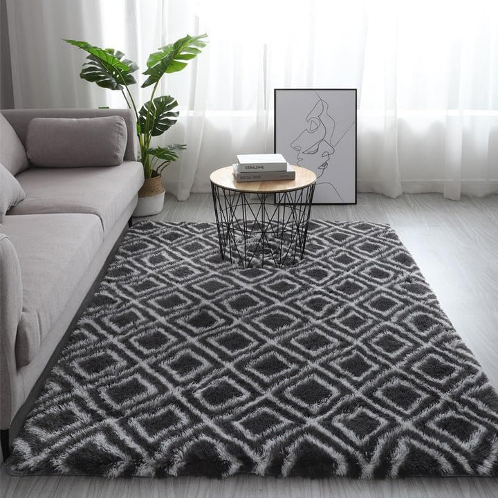 VibeCore Plush Patterned Area Rug in white design on a black background, featuring a soft polyester fiber texture and non-slip backing. Adds comfort and style to any room, perfect for living rooms, bedrooms, or dorms. Easy to clean and available in 5 stylish options.