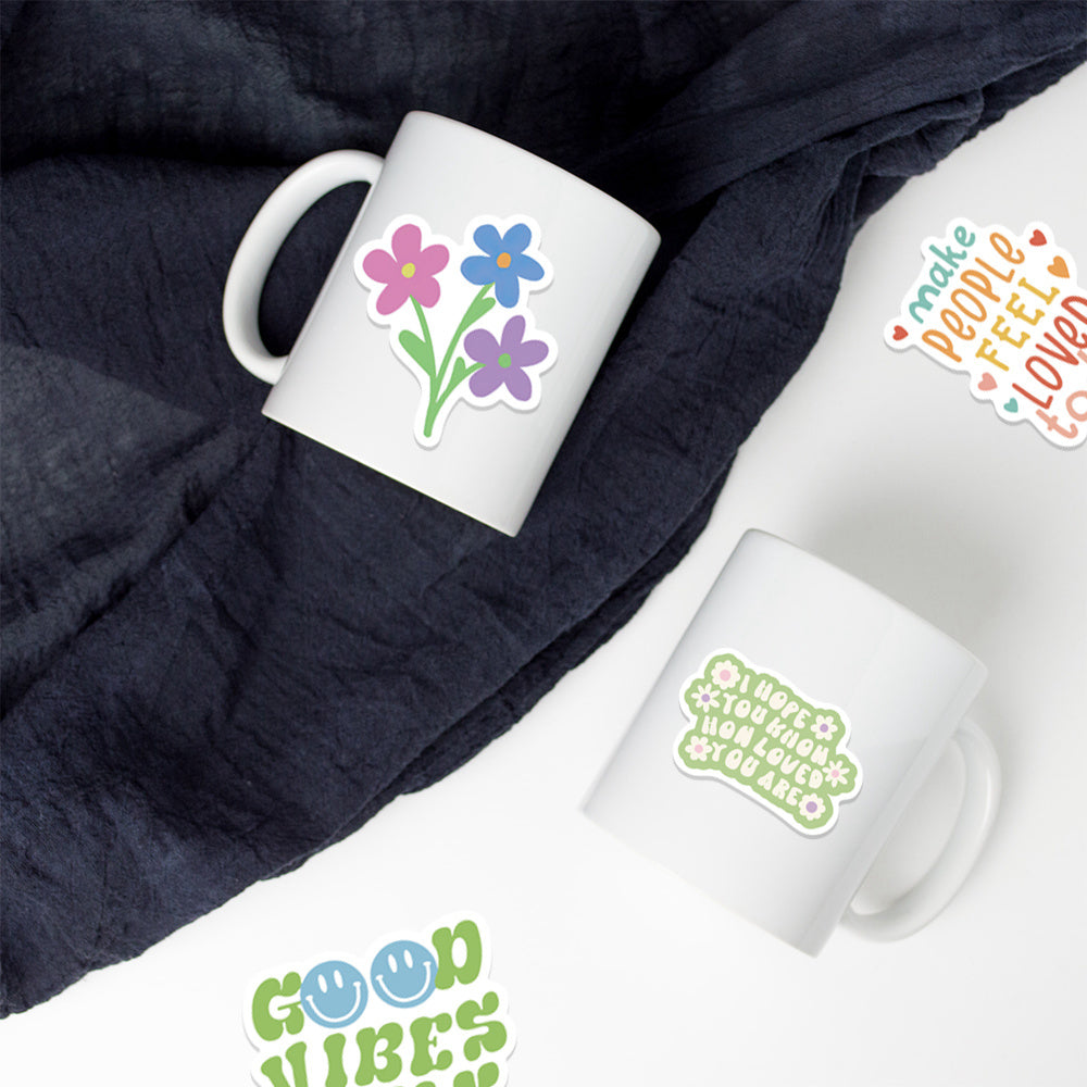 VibeCore Preppy Positivity Stickers applied to mugs, featuring colorful, motivational designs like smiley faces and positive quotes for a cheerful, uplifting look.