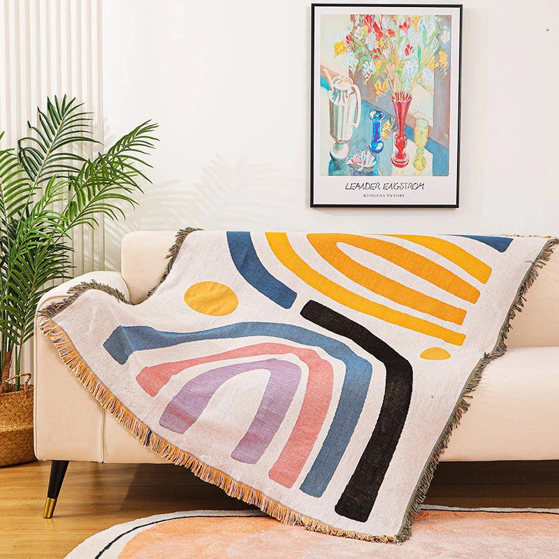 Rainbow Dreams Woven Cotton Blanket Draped Over Couch – Reversible Boho Throw for Colorful, Cozy Living Room Decor