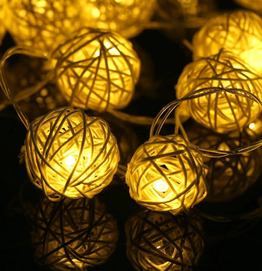 Close-up of VibeCore Rattan Ball String Lights, showcasing their natural design and warm white glow.