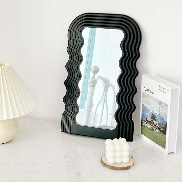 VibeCore Retro Wave Mirror placed on a desk, showcasing its wave-shaped resin frame and sleek mirror lens, effortlessly blending retro style with a modern aesthetic.