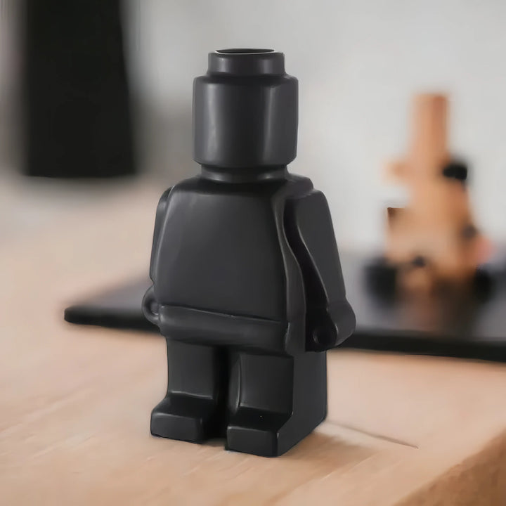 Aesthetic robot vase in black featuring a sleek minimalist design with pop-culture influence perfect for adding a bold artistic touch to shelves tables or modern home decor.
