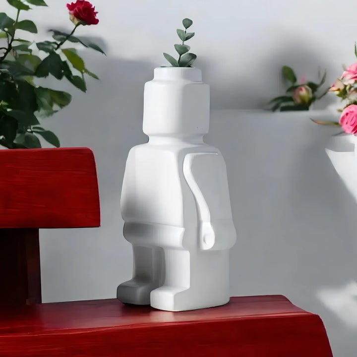 Aesthetic robot vase in white featuring a sleek minimalist design with pop-culture influence perfect for adding a bold artistic touch to shelves tables or modern home decor.