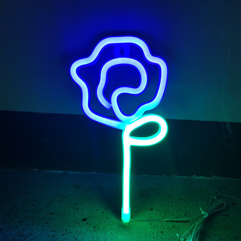 VibeCore Rose Neon Light in blue, offering a soft and elegant glow for a romantic ambiance. Perfect for bedrooms, dorms, or lounges.