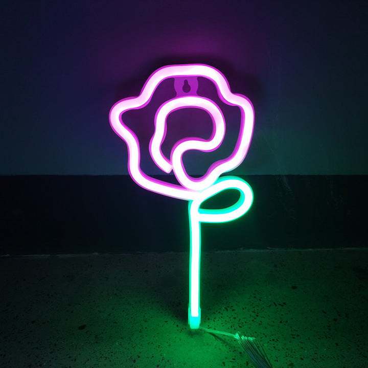 VibeCore Rose Neon Light in pink, casting a soft, romantic glow in any space, ideal for bedrooms or lounges.