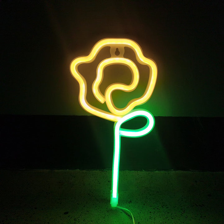VibeCore Rose Neon Light in yellow, adding a warm, romantic glow to any space, perfect for bedrooms or lounges.