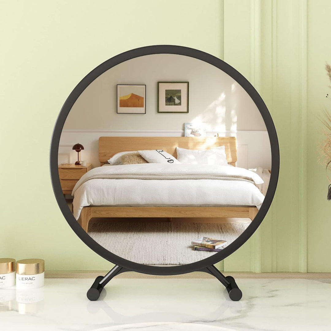 VibeCore Round Vanity Mirror in black on dresser, sleek minimalist design, high-resolution reflection, ideal for modern bedroom decor, practical and stylish home accent.