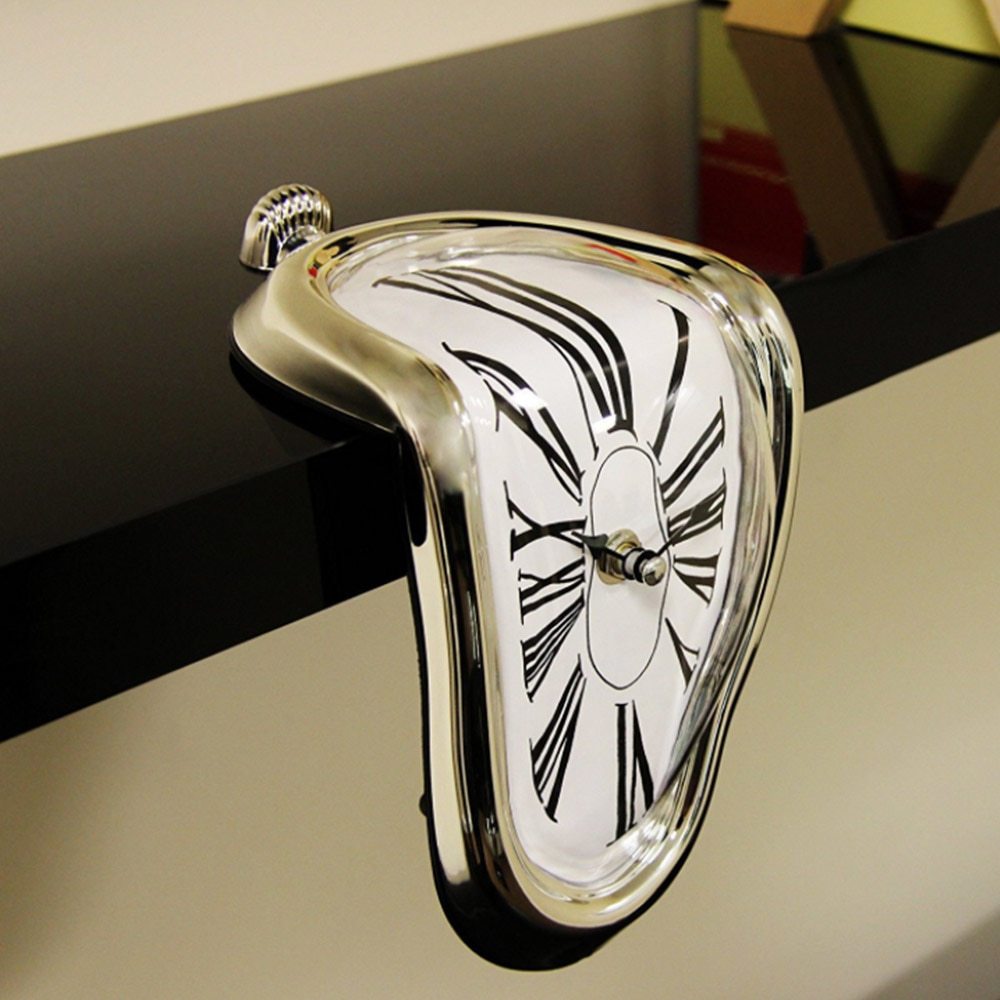 Gold Salvador Dali-inspired melting clock elegantly draped over a mantle, blending surrealist art with functional timekeeping for a unique decor statement.