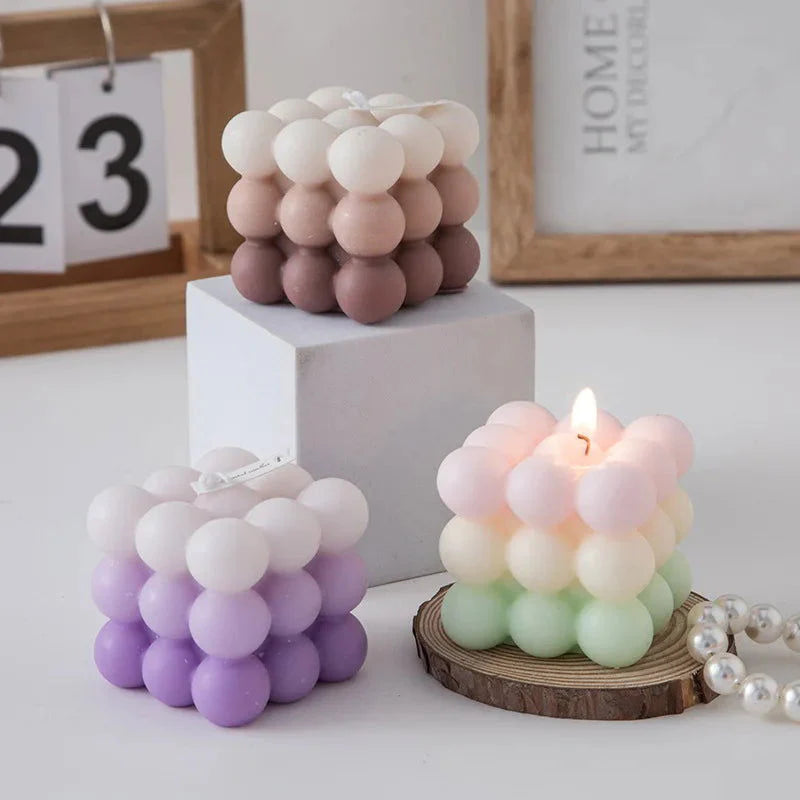 Scented Gradient Bubble Cube Candle in brown, pastel green, and purple