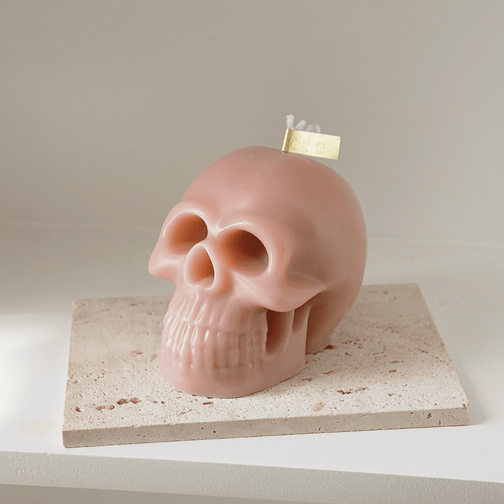 Mauve scented skull candle, featuring a bold, striking design and captivating fragrance, perfect for adding an edgy yet unique touch to your room decor.