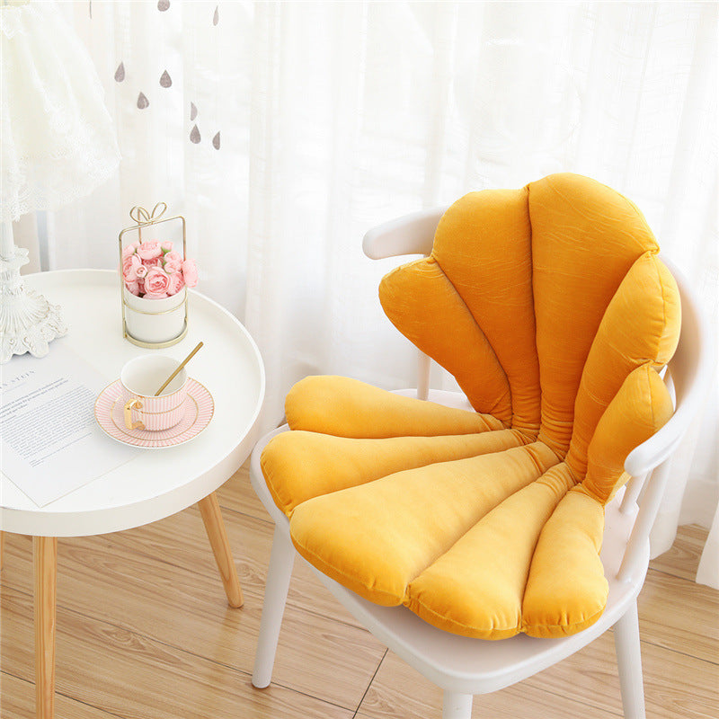 VibeCore Seashell Seat Cushion in Yellow. This playful cushion features a seashell shape, crafted from soft velvet plush fabric and filled with PP cotton for a cozy feel. A perfect addition to bring a bright, coastal touch to your seat or space.