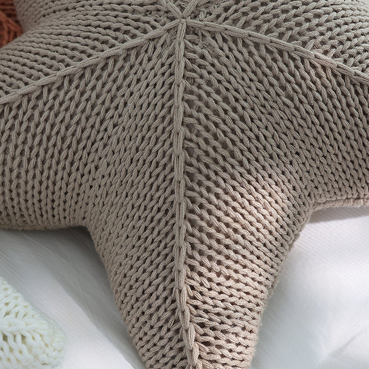Close-up view of the VibeCore Starfish Hand-Knitted Throw Pillow, showcasing its detailed knit texture and coastal-inspired starfish design.