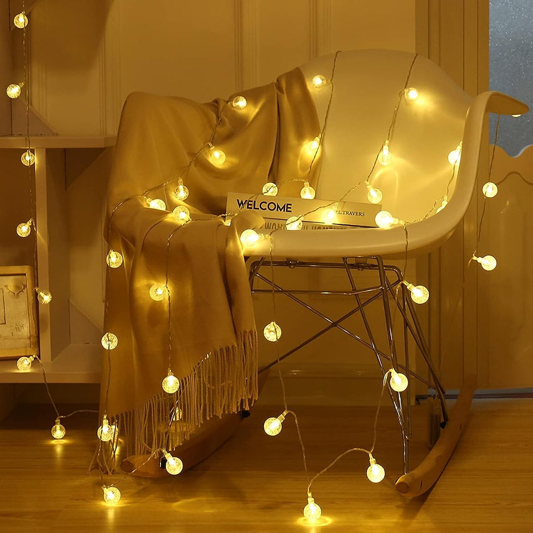 VibeCore Starry Bulbs String Lights on chair – warm white LED string lights creating a cozy, aesthetic ambiance in any space.