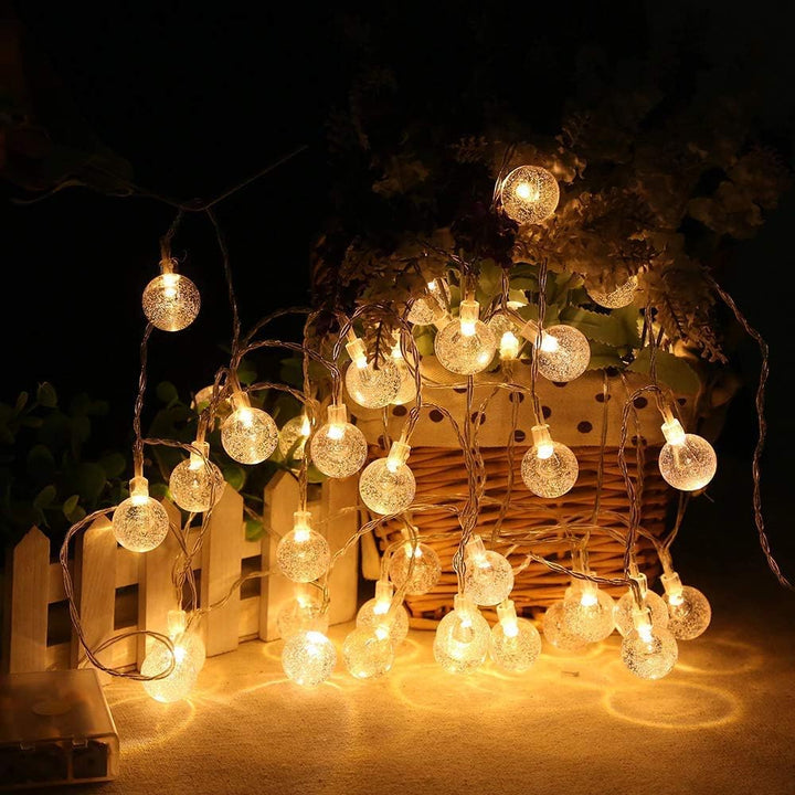 VibeCore Starry Bulbs String Lights under tree – warm white LED string lights adding a cozy glow, perfect for bedroom, dorm, or holiday decor.