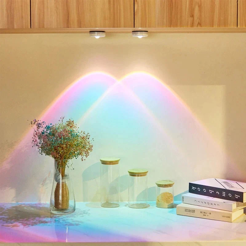 VibeCore Sunset Puck Light in two vibrant colors, installed under a cabinet, offering a soft, sunset-inspired glow with adjustable brightness for a cozy ambiance.