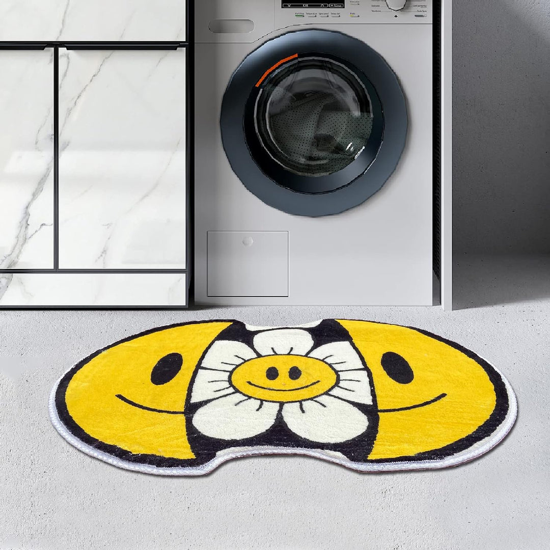 VibeCore Sunshine Split Smiley Accent Rug in front of a washing machine, featuring a playful design with a smiling face splitting open to reveal a vibrant sunflower, adding a fun touch to the laundry area.