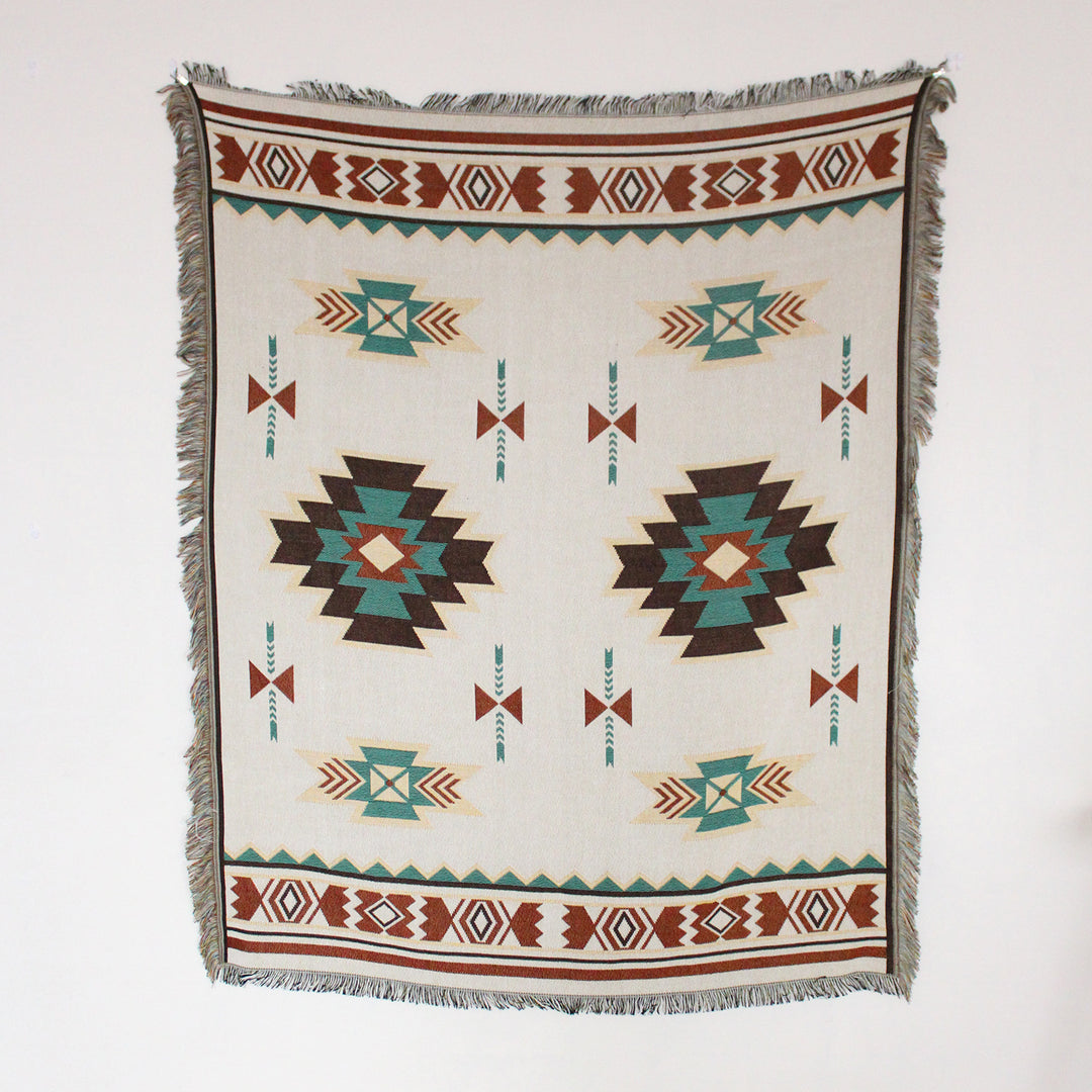 VibeCore Terra Medallion Woven Blanket displayed flat, showcasing its intricate earthy medallion pattern, highlighting its soft, reversible 100% cotton design.