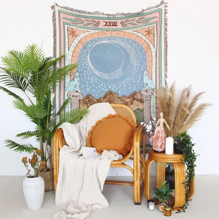VibeCore The Moon Tarot Woven Blanket as a wall hanging, showcasing celestial-inspired design and soft 100% combed cotton texture.