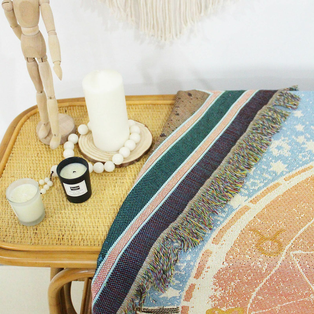 Close-up of VibeCore The Star Tarot Woven Blanket, showcasing its reversible design with celestial-inspired patterns on both sides, crafted from soft, durable 100% combed cotton.