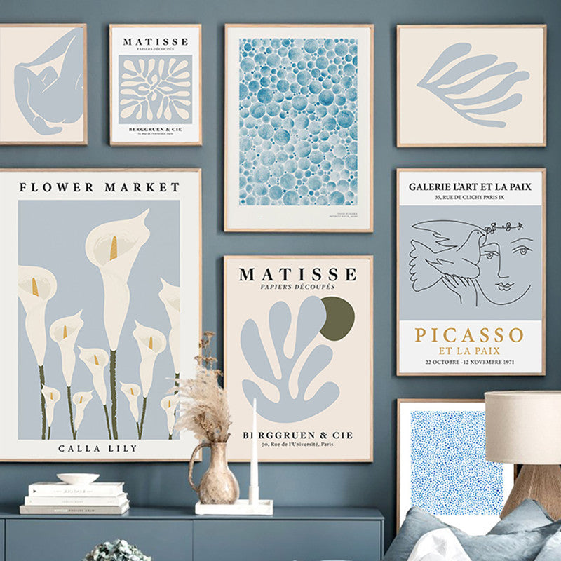 VibeCore Timeless Blue Canvas Posters wall collage featuring pastel blue abstract prints inspired by Matisse, Picasso, and vibrant flower markets. These modern art posters bring a serene and artistic atmosphere to any bedroom or dorm.