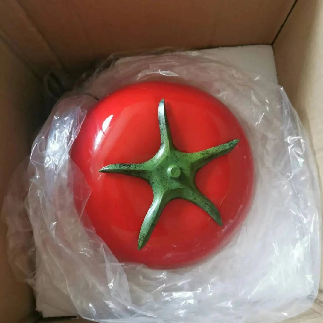 A quirky and fun lamp, featuring the red tomato design, packaged for safe delivery, ready to add a playful touch to any space.