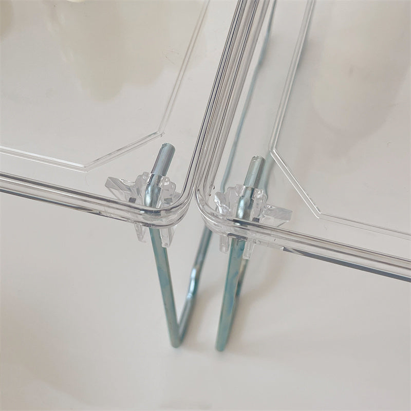 VibeCore Transparent Acrylic Foldable Shelf leg close-up, highlighting the rust-free metal leg for durability and elegant design, adding a modern touch to any space.