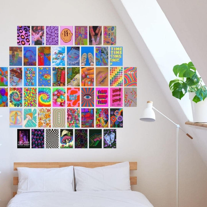 VibeCore Trippie Hippie Wall Collage Kit above bed featuring 70 colorful indie prints with vibrant, hippie-inspired designs. Perfect for dorm room, bedroom, indie decor, hippie vibes, trippy, VSCO aesthetic, and colorful wall decor.